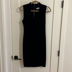 Velvet blue cocktail dress with exposed zipper in back.